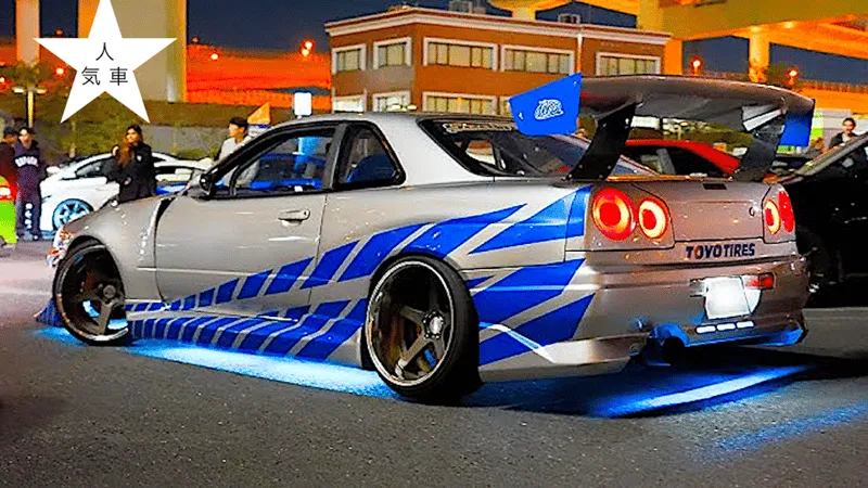 Convoy of JDM cars led by a Nissan GT-R cruising Tokyo expressways at night on a real Fast and Furious Tokyo drift experience in Japan